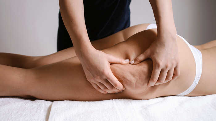 woman having a massge to treat cellulite woman having a massge to treat cellulite